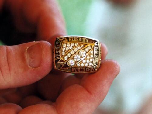 Holding a Super Bo;wl ring